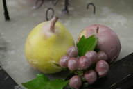 Wax coated fruits and plants for a dinner table decoration